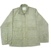 Folded green shirt with a label on a white background