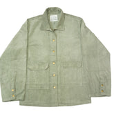 Folded green shirt with a label on a white background