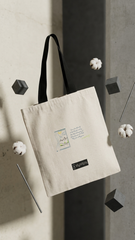 Beige tote bag with a brand logo on a textured wall background